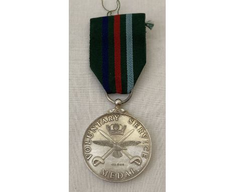 A silver Voluntary Service Medal on ribbon. Hallmarked London 1994.  