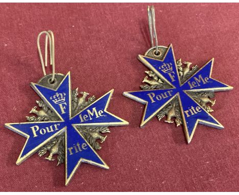 2 reproduction Pour Le Merite medals with blue enamel finish and eagle detail.  