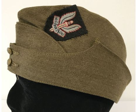 A WWII style British Army side cap with hand embroidered S.A.S cap badge sewn on.  