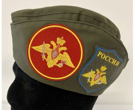 A Russian army forage hat with side patches.  Marked 58 to inside. 
