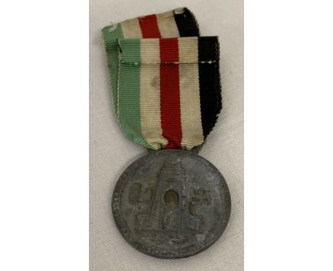 A WWII style Italian - German campaign medal on ribbon.  
