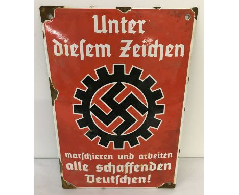 A German WWII style enamel sign in red, black and white.  Sign reads "All Creative Germans march and work under these symbols