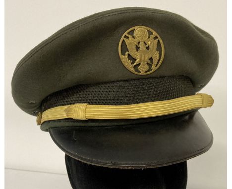 A Vietnam war era American army peaked cap with cap badge.   Size 7 2/8th.