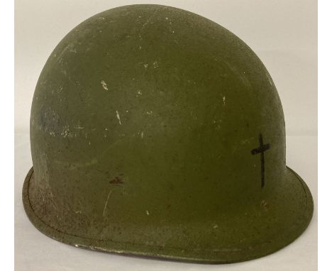 A US M1 steel helmet with Army Chaplain's cross painted on front.  Complete with liner. Circa 1960's, Vietnam War, liner date