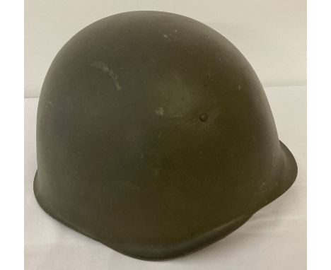 A Polish wz 1950 steel helmet used by the Syrian Army 1960's -70's.  With leather chin strap and stamp marks to cradle. 