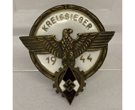A WWII style Hitler Youth 1944 Kreissieger brass and enamel badge.   Approx. 5cm tall.