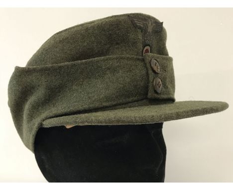 German WWII style army M42 green felt Field/ski cap with early double button design.   Size 55.