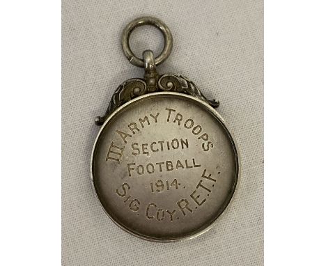 An antique silver watch fob/medallion engraved "Lance Corpl R. Harrison" to front.  "III Army Troops Section Football 1914 Si