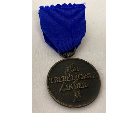 A WWII style SS 4 year service medal on blue ribbon.  
