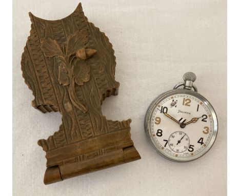 A WWII Helvetia British Military pocket watch with carved wooden folding watch stand.  Top winding, enamelled faced watch wit