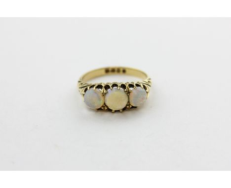 An opal three stone ring claw set in 18ct yellow gold, London 1900