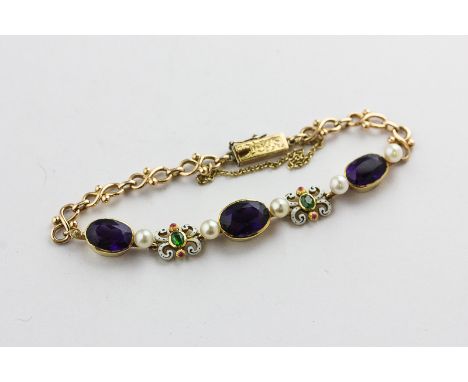 An amethyst, emerald, pearl and enamel bracelet in late 19th century taste, rubover set with three oval amethysts with emeral