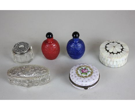 Two silver mounted cut glass dressing table jars, a porcelain trinket box, a bone inlaid brass box and two Parisian scent bot