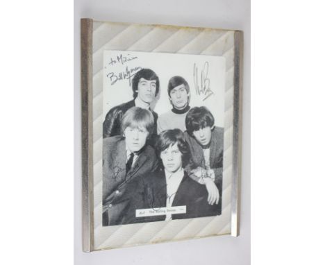 A black and white autographed Rolling Stones photograph, signed in black pen 'to Miriam' by Mick Jagger, Keith Richards, Bria