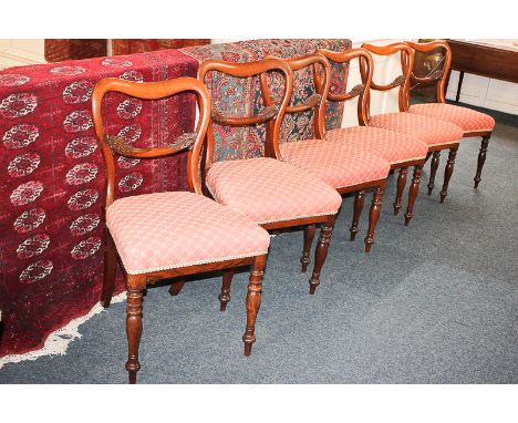 A set of six Victorian rosewood kidney back dining chairs by R Taylor & Sons, with upholstered seats, on turned front legs, p