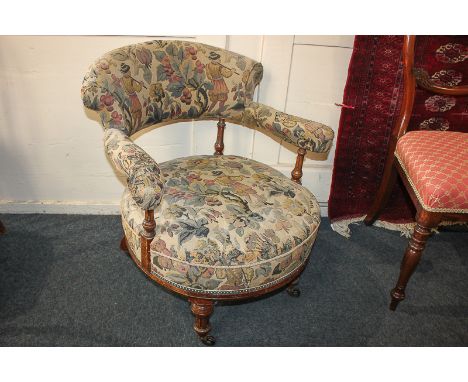 A Victorian mahogany framed tub chair, with tapestry style upholstered back rail and seat, on turned and fluted supports and 