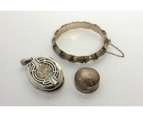 A silver and overlaid locket, a bangle, a pill box