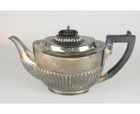 An Edward VII silver teapot, oval shape with demi-reeding, maker Barker Brothers, Chester 1906, 16oz