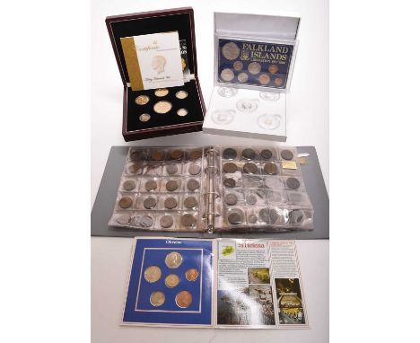 An album containing UK and foreign silver, cupro-nickel, copper and bronze coinage - together with large collection of silver