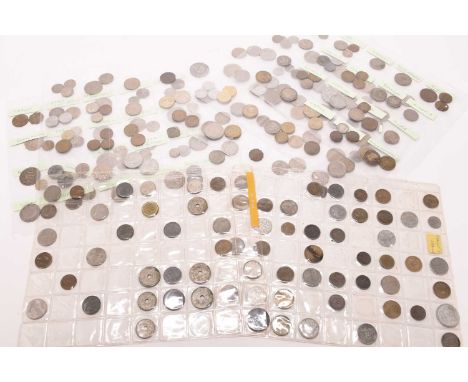 An assortment of UK and foreign silver, cupro-nickel, copper and bronze coinageWith USA and foreign banknotes. (Quantity)