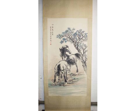 A CHINESE SCROLL PAINTING, of two horses, circa 1930, 133cm x 67cm.