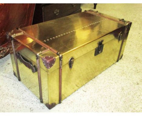 TRUNK, gold coloured with a rectangular rising top enclosing space for storage and a carrying handle to each side, 101cm W x 