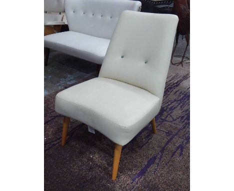 DESIGNER GUILD CHAIR, in cream leather button back on turned supports, 59cm W.