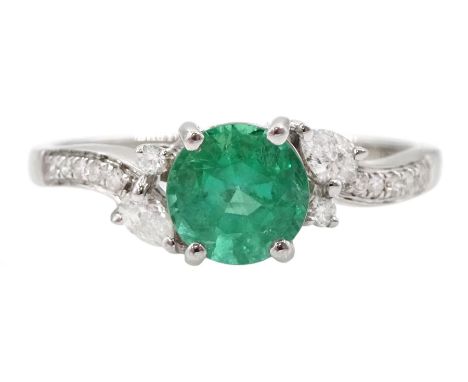 18ct white gold round cut emerald, pear and round brilliant cut diamond ring, with diamond set shoulders, hallmarked, emerald