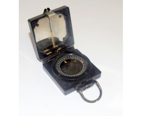 A WW2 Mark.1 magnetic Marching Compass with War Department arrow. Made by T.G. & Co. Ltd.
