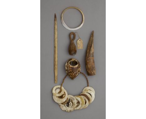SIX  ARTEFACTSA shell bracelet; a shell tool; a fibre ornament; a fish spine; a shell; a bamboo and spine implement; and a gr