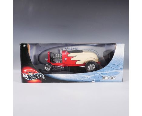 A 100% Hot Wheels die-cast model featuring the iconic 1932 Ford Coupe in a bold red and cream flame design. This detailed col