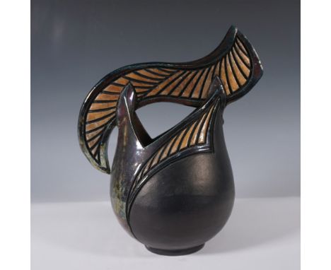 Unique handcrafted black ceramic vase featuring an eye-catching sculptural winged design with carved detailing. The vase has 
