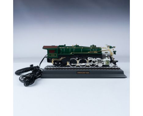 This unique Crescent 1925 locomotive-shaped telephone combines vintage charm and functionality. Modeled after a classic steam