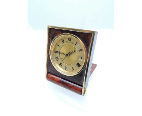 JAEGER LE-COULTRE TRAVELLING ALARM CLOCK, in a folding simulated tortoiseshell and brass case, 40 x 52mmsProvenance: private 