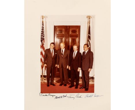 PRESIDENTSPhotograph signed by Ronald Reagan, Gerald R. Ford, Jimmy Carter, and Richard Nixon.  A color-printed photograph on