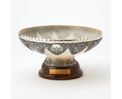 Silver-mounted agate presentation bowl, centering a Garuda Pancasila, the national emblem of Indonesia, on a wood stand with 