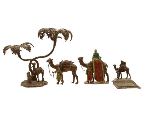 A group of four cold painted spelter figures, 20th century, in the manner of Franz Xavier Bergman, comprising a camel group b