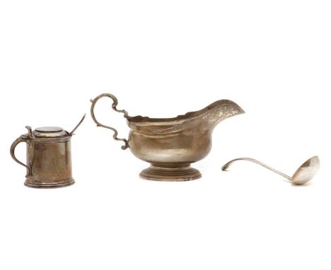 A silver sauceboat,by JCL, London 1960, 9.5cm high,together with a silver mustard pot,by Viner's Ltd, Sheffield 1936, 6.5cm h