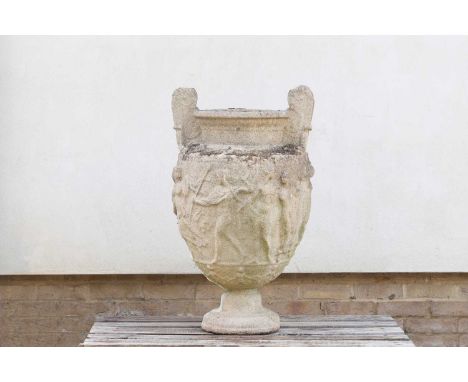 A composite stone urn,20th century, the body decorated in relief with classical figures, 55cm wide48cm deep95cm highThe Estat