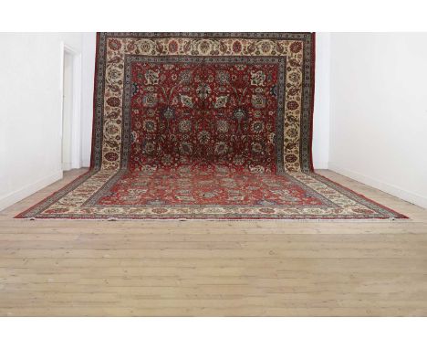 A large Tabriz wool carpet,20th century, North West Persian, bearing a signature to the border, 506 x 360cm