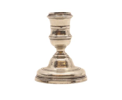 A cast silver dwarf candlestick,appears 18th century, with turned detail to sconce, no marks,8cm high 4.4oztCondition ReportS