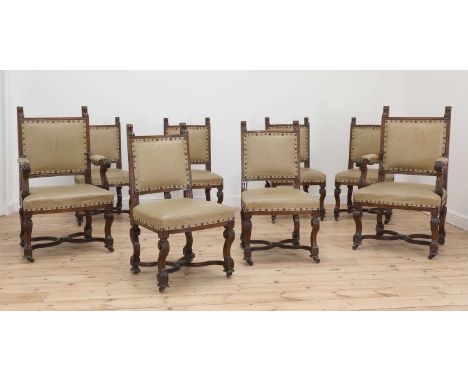 A set of eight late Victorian oak dining chairs by Gillows,comprising two armchairs and six single examples, each with moulde