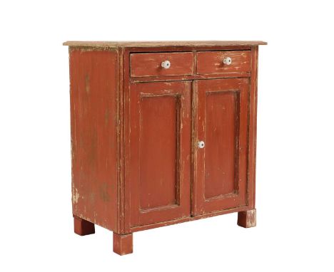 A continental red-painted pine cupboard19th century, with two drawers over a cupboard, enclosing a shelf, on later block supp