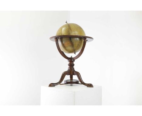 A 12-inch Phillips terrestrial library table globe,early 20th century, on a tripod support united with a compass,42cm diamete