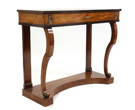 A mahogany console table,19th century, Continental, with ebony line inlay and gilt metal mounts, raised on scrolled supports,