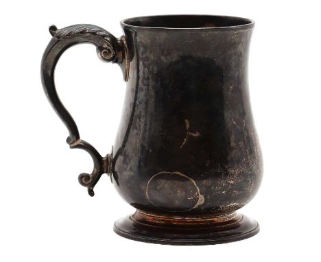 A George II silver tankard,makers marks for Thomas Whipham, London 1745, of plain form with a scrolled handle, inscribed late