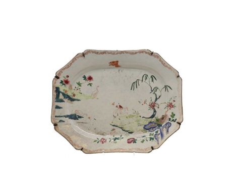 A Chinese porcelain meat dish,late 18th to early 19th century, of shaped rectangular form, enamelled with a figure atop a buf