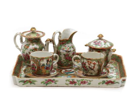 A Chinese famille rose porcelain tea service,20th century, comprising: a teapot, jug, sugar pot, two cups and saucers, and a 