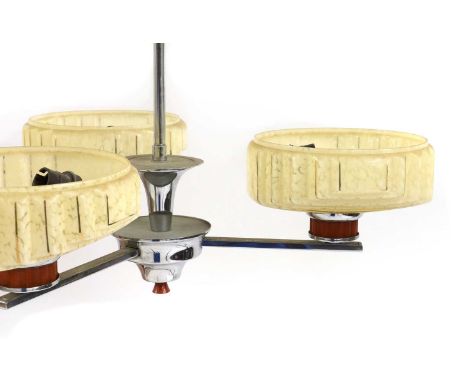 A suite of Art Deco light fittings,comprising a chrome, bakelite and glass three branch chandelier, 53cm wide, 50cm high, and
