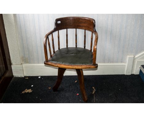 Antique American Oak Swivel Desk Chair of typical form, supported on three shaped legs, with a green leatherette covered seat